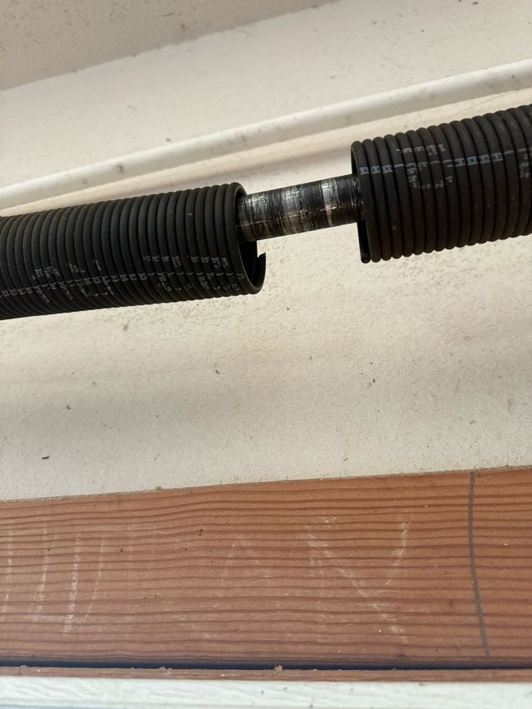 Close-up of a garage door torsion spring in Winchester, CA