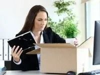 Woman in Black Suit Packing Belongings Into a Box — Dwyer Law Group in Surfers Paradise, QLD