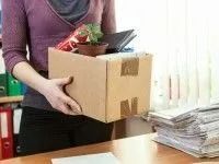 Woman Holding a Cardboard Box With Belongings — Dwyer Law Group in Surfers Paradise, QLD
