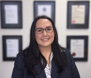 Woman in Glasses and Blazer Smiling — Dwyer Law Group in Surfers Paradise, QLD