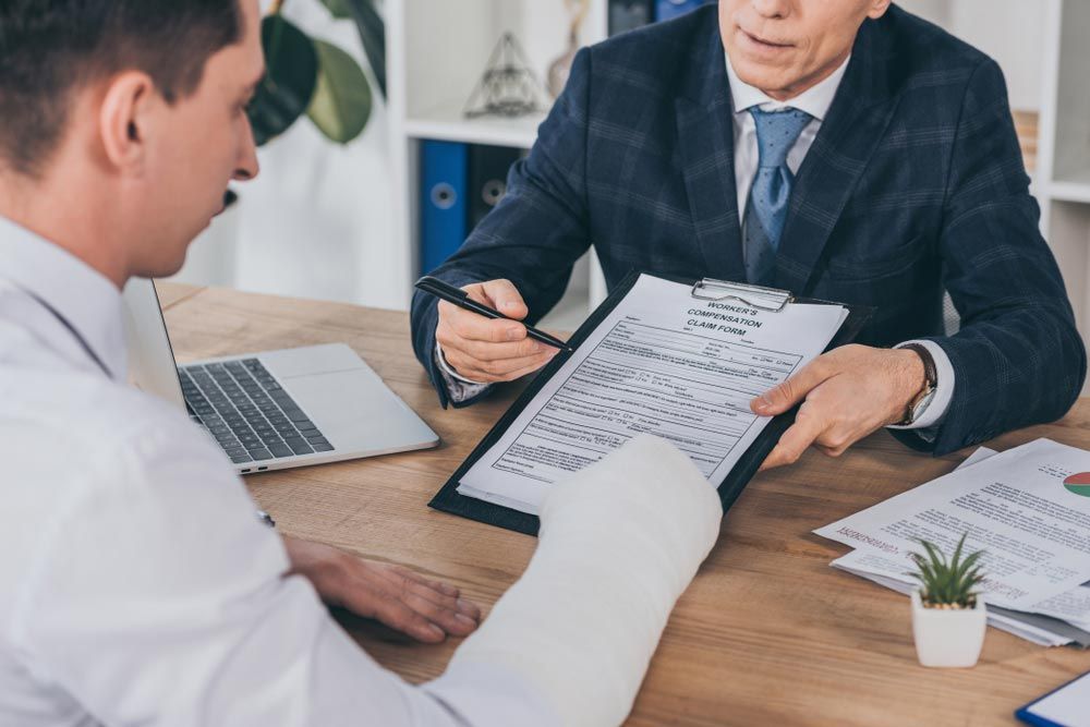 Man With Injury Filling Out A Claim