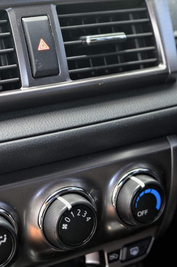 A Close Up of a Car Dashboard With Air Vents and Buttons — Red Central Towing & Recovery In Alice Springs, NT