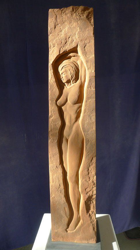 Stone carved female sculpture.