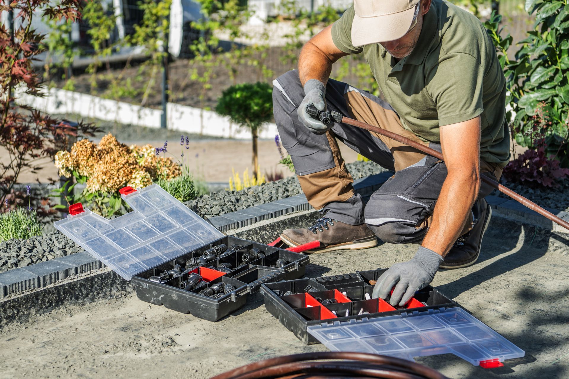 Worker installing solar panels on a rooftop, kneeling beside tools and panels under bright sunlight Worker installing solar panels on a rooftop, kneeling beside tools and panels under bright sunlight