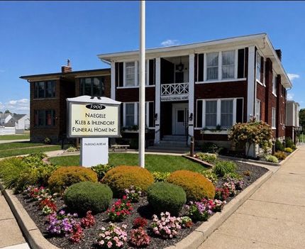 A large brick building with a sign that says ' funeral home ' on it