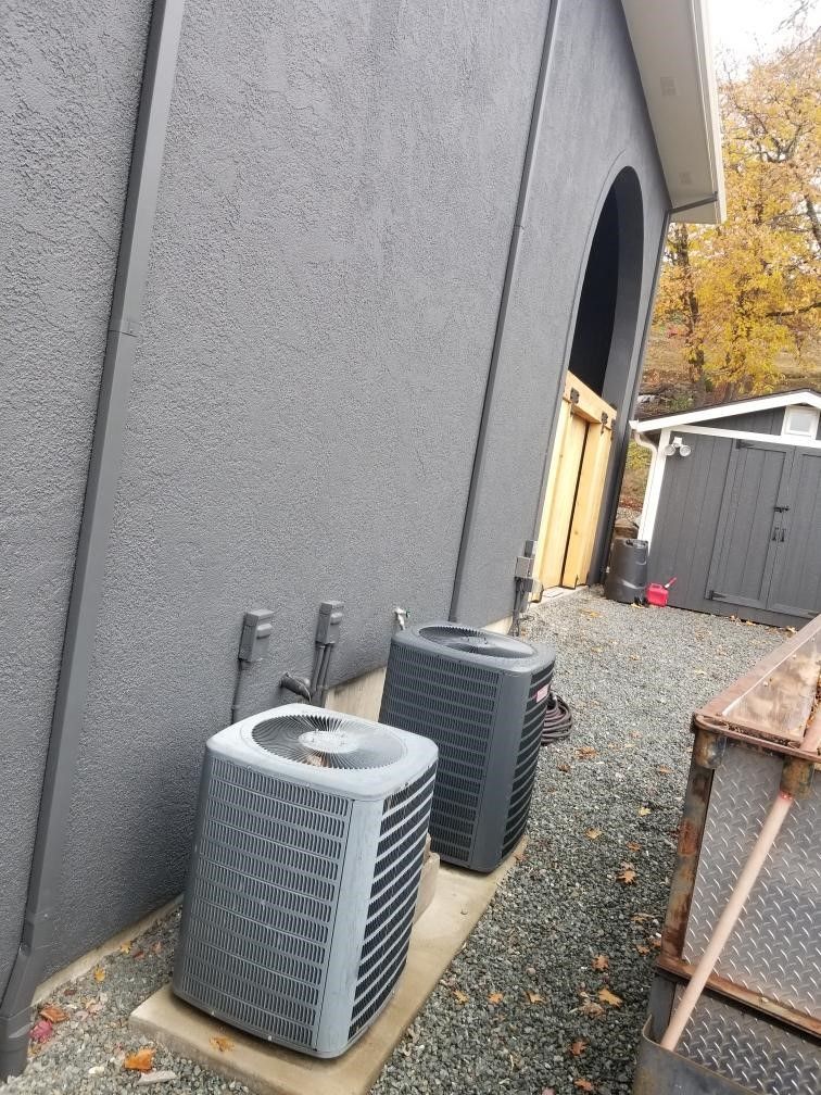 A duct in a basement with a lot of insulation on it