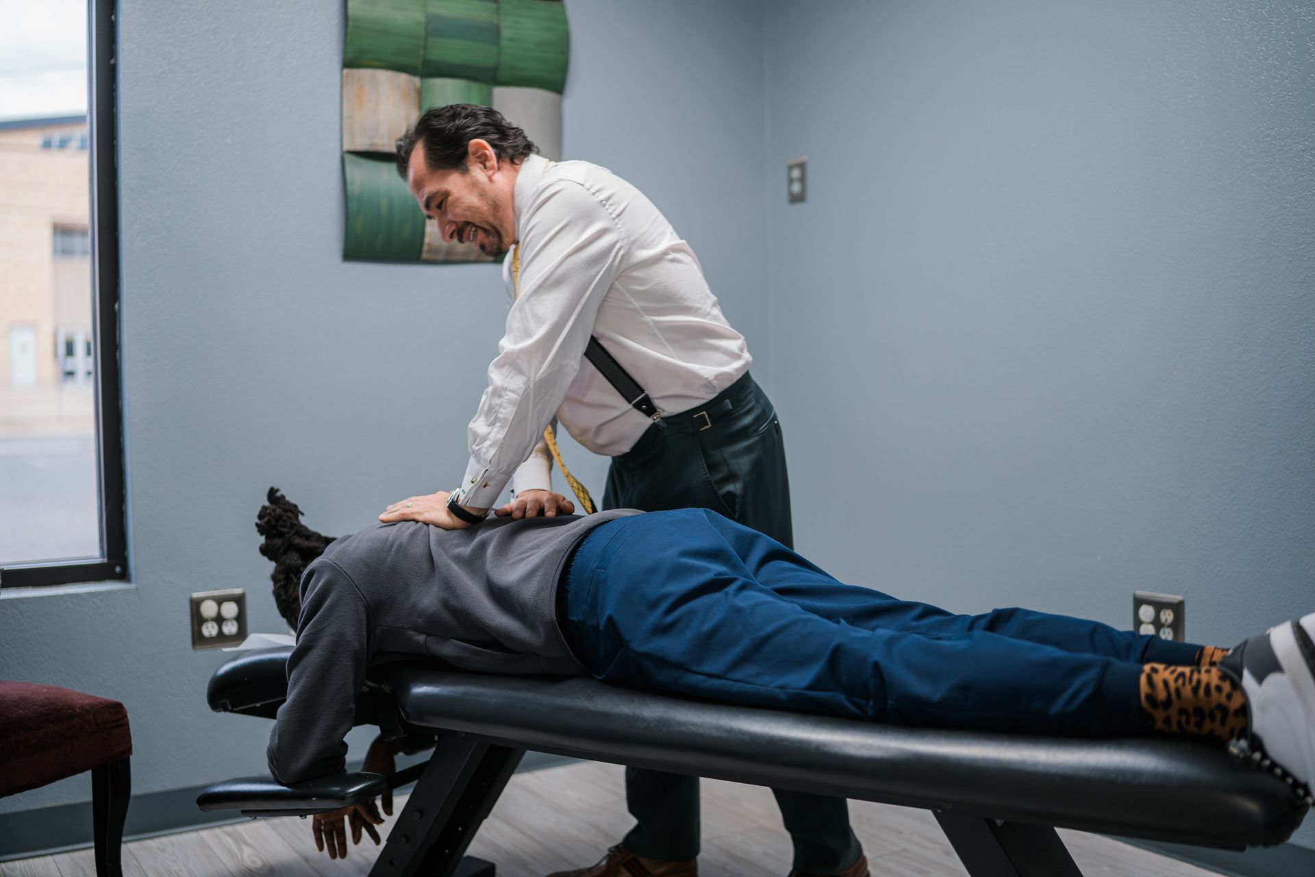 chiropractor working on a patient's back
