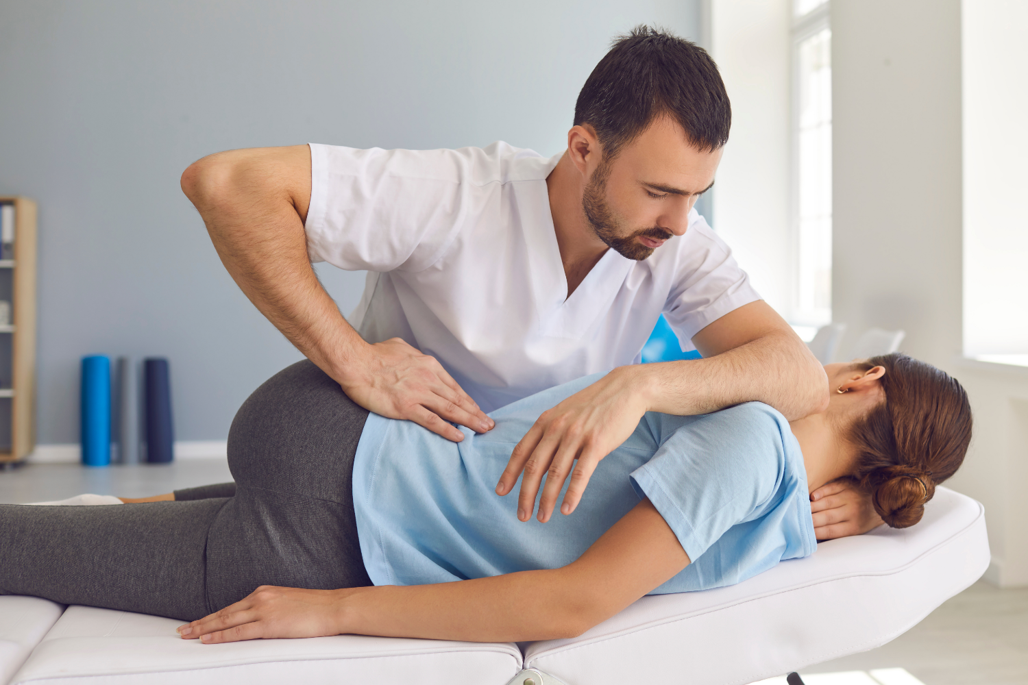 chiropractor with a patient