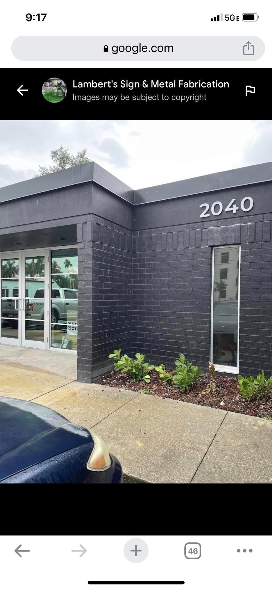 Black building with white address numbers, 2040.