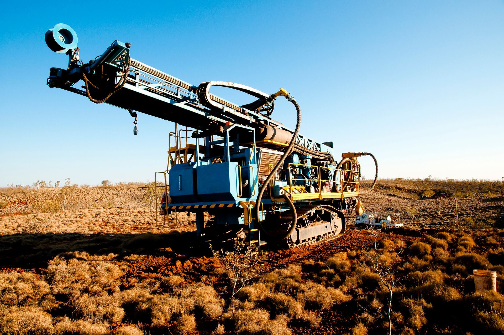 A large machine is sitting in the middle of a field.