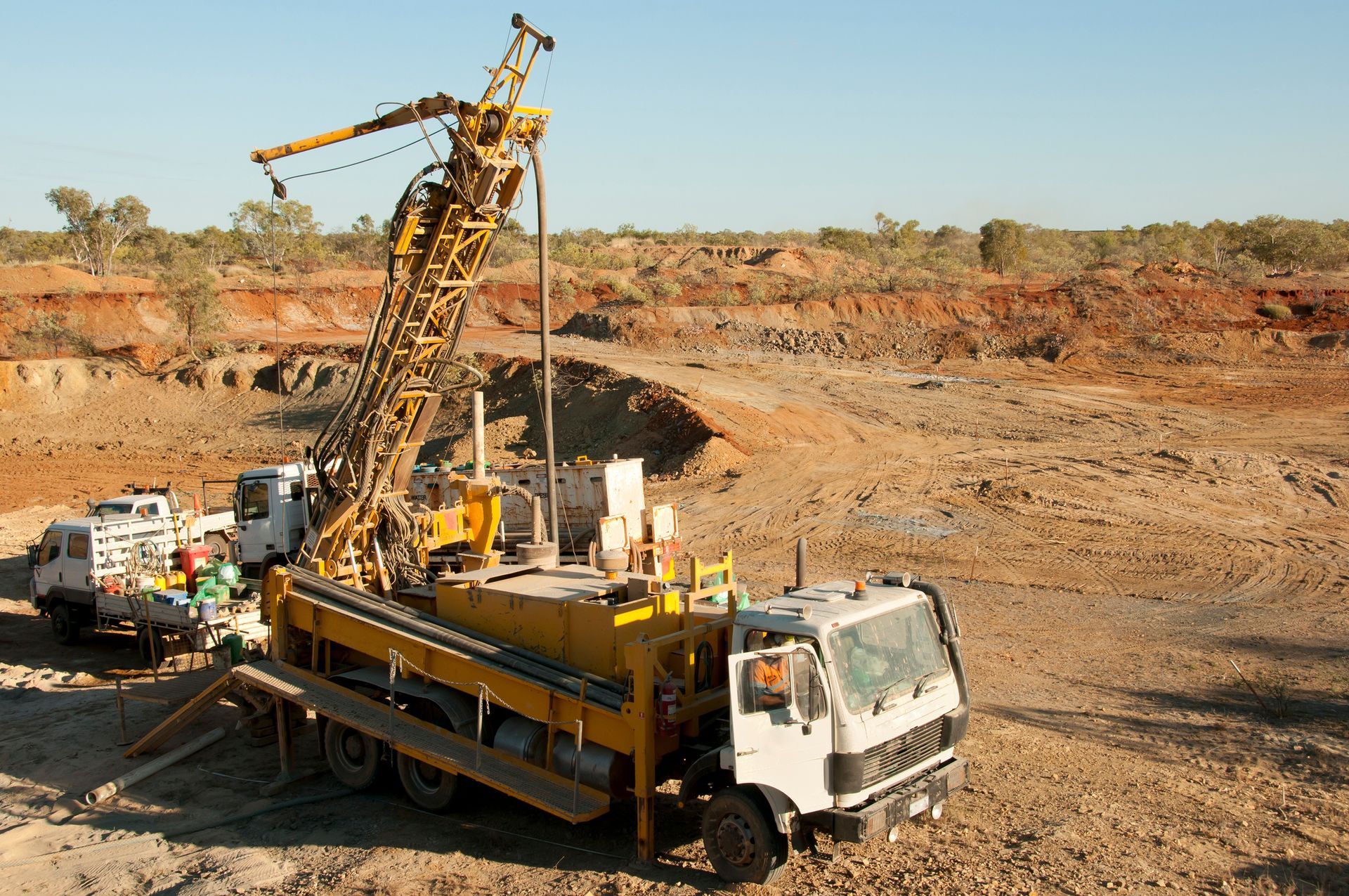 A truck with a yellow crane on top of it