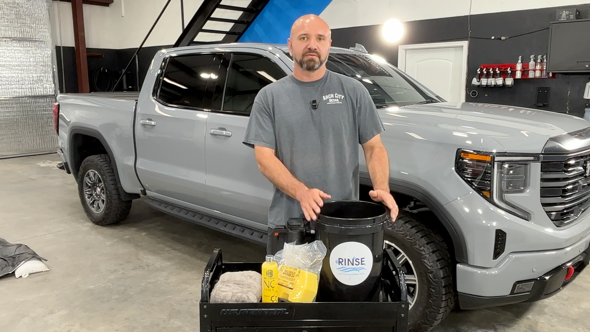 Arch City Detail technician demonstrates rinseless washing for maintaining a ceramic coated car