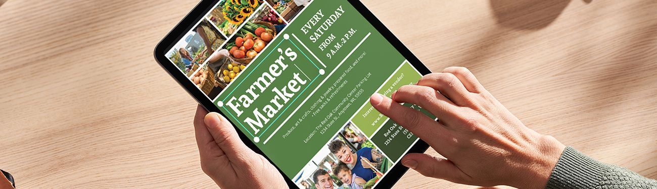 A person is holding a tablet with a farmer 's market advertisement on it.