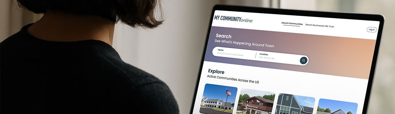 Person using a laptop showing the My Community Online website.