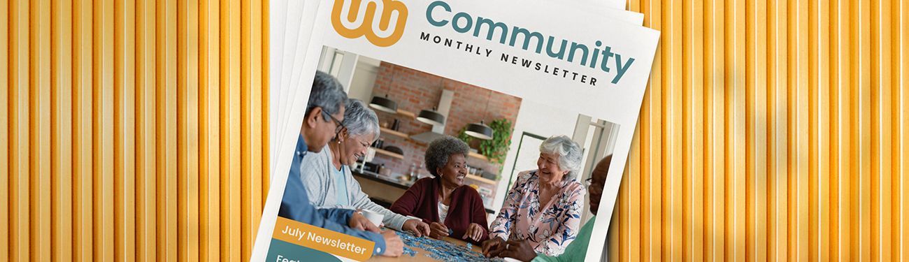 A group of people are sitting at a table in a community brochure.