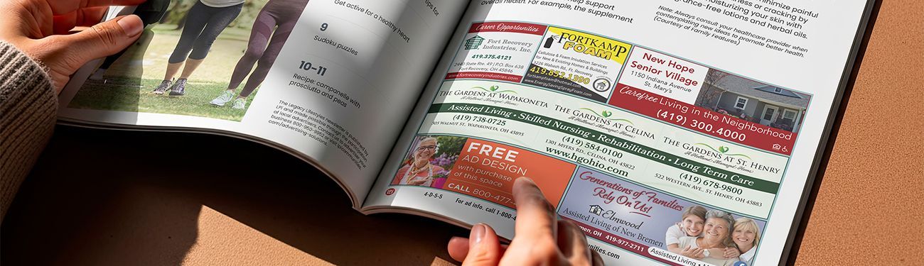 Close-up of a newsletter turned to the ads section.