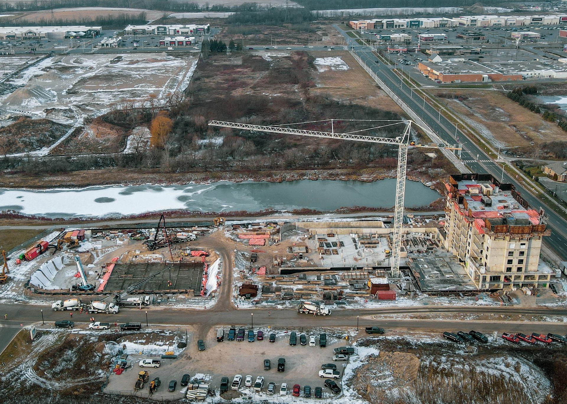 An aerial view of a construction site with a large building under construction.