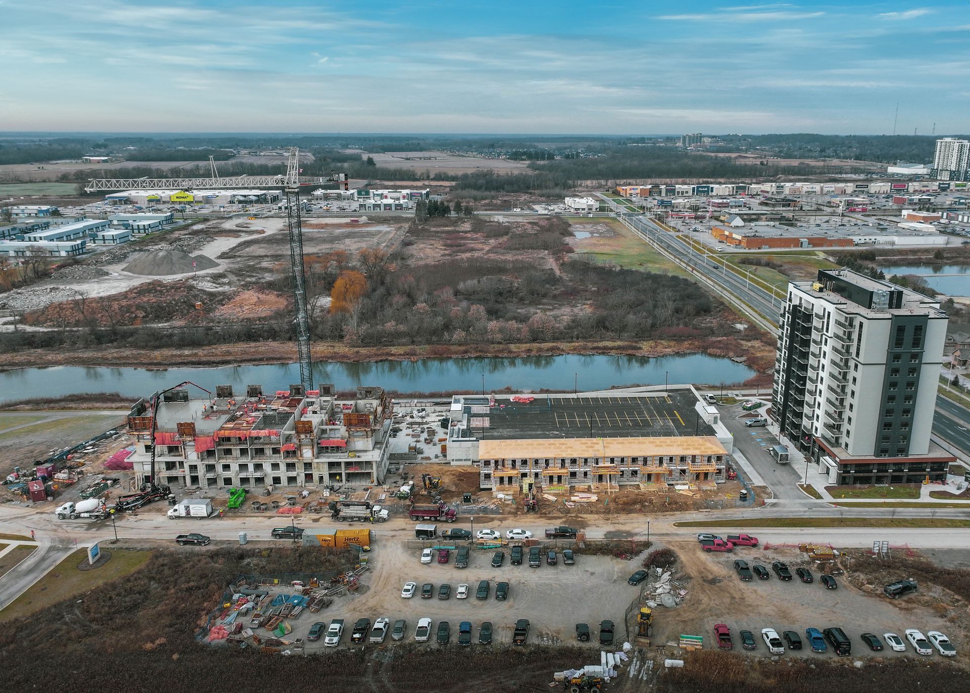 An aerial view of a city with a lot of buildings and a river.