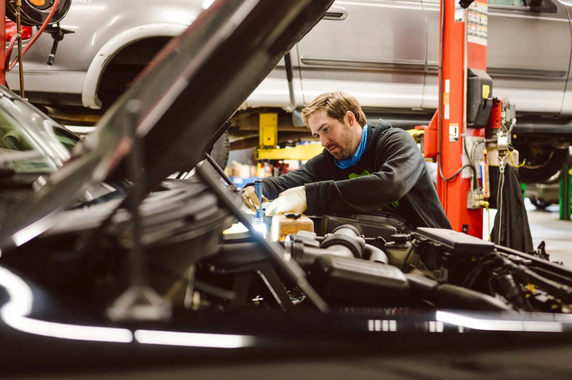 technician working on engine | Casey's Automotive