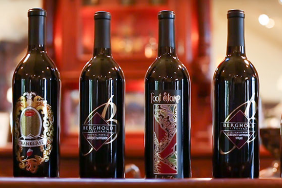 A group of people are toasting with wine glasses.