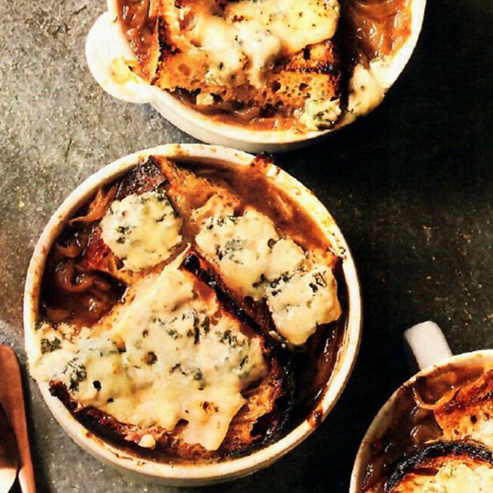 Two bowls of french onion soup with bread and cheese