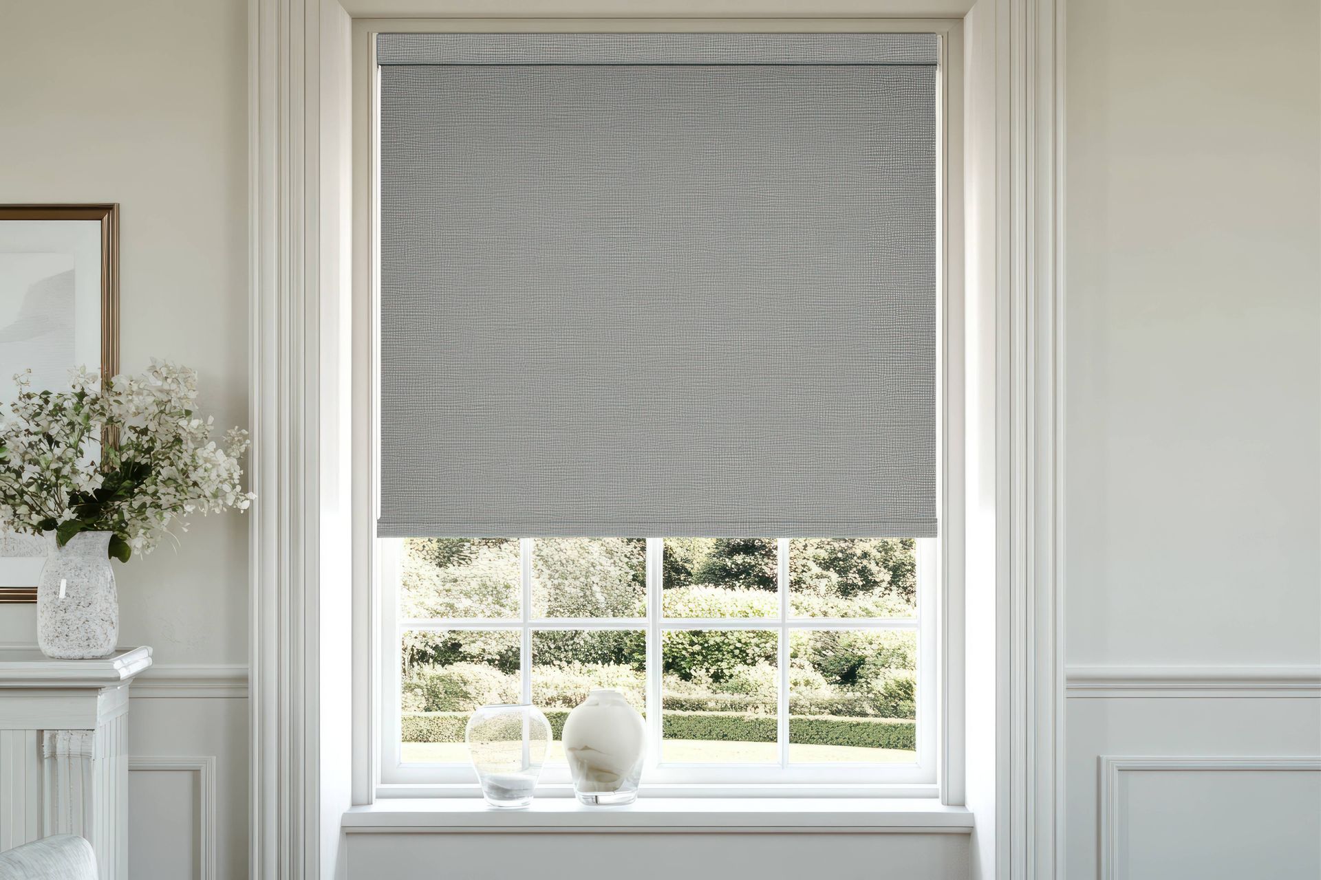 Gray roller shade in a modern living room at Blinded by Delight Window Coverings & Design near Boerne, Texas (TX)