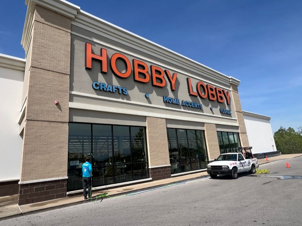 Hobby Lobby storefront with large red sign, glass windows. Pressure Washing & Window Cleaning in Huntsville