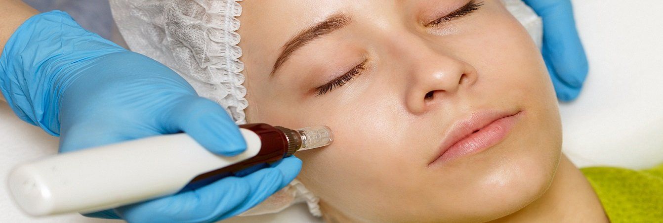 A woman is getting a facial treatment at a beauty salon.