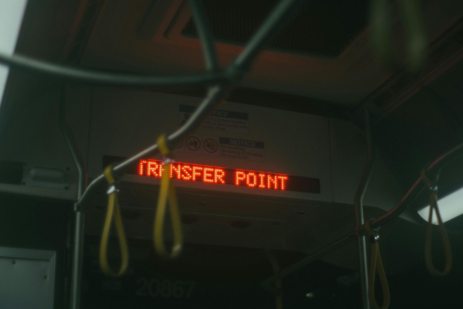 A digital red display inside a bus shows the text