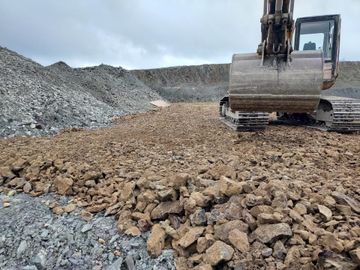 A digger at work on a quarry