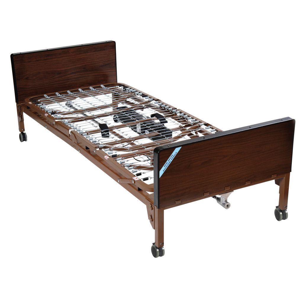 A brown, electric medical bed with a metal spring frame and wooden-look headboard and footboard on wheels.