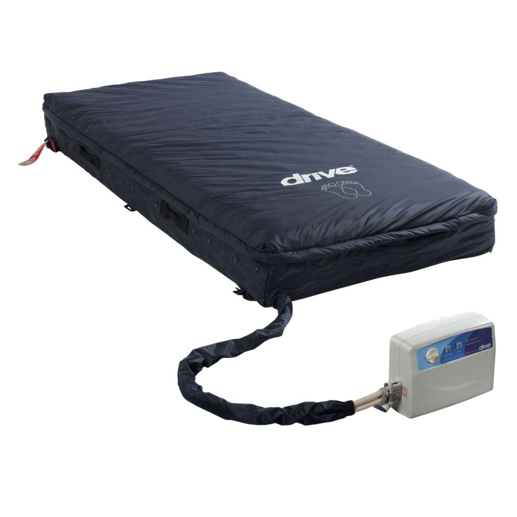 A dark blue alternating pressure mattress system with a connected control unit and air hose.