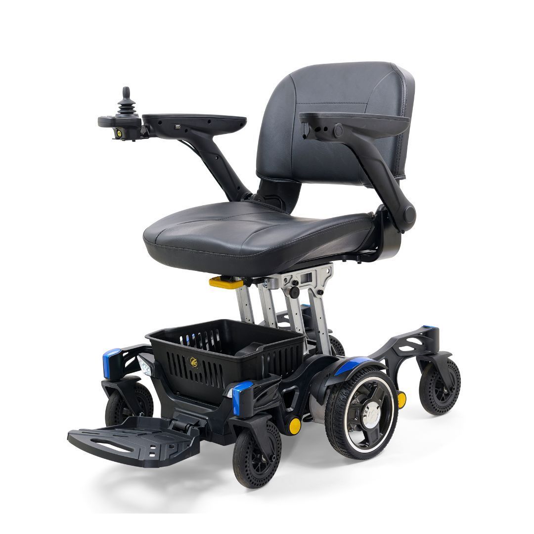 A black motorized power wheelchair with a storage basket, joystick controller, and elevated seat on a white background.