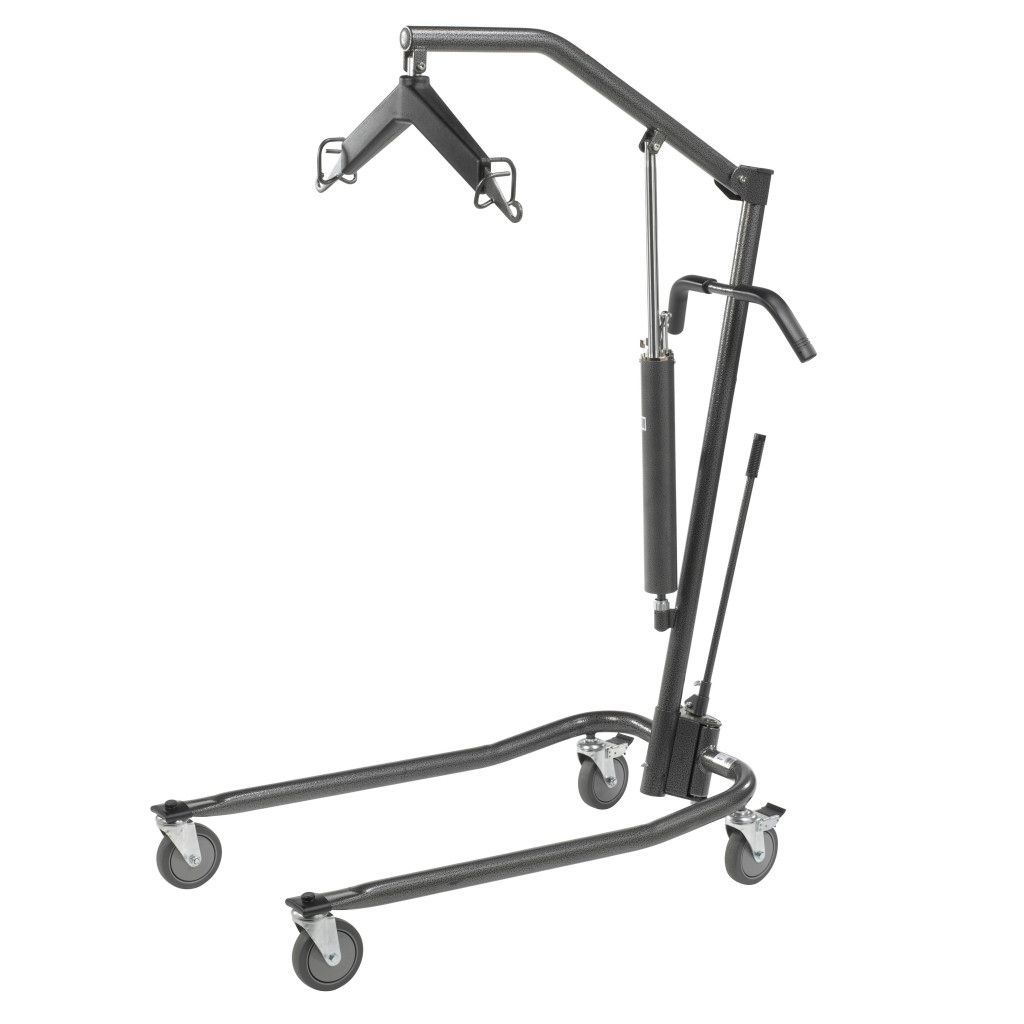 A dark gray hydraulic patient lift for medical use, featuring a spreader bar, lifting arm, and four rolling casters.