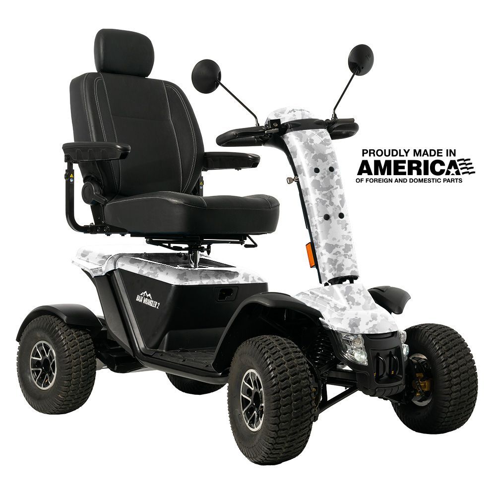 A black and white camouflage mobility scooter with a black leather seat and rugged tires, labeled 