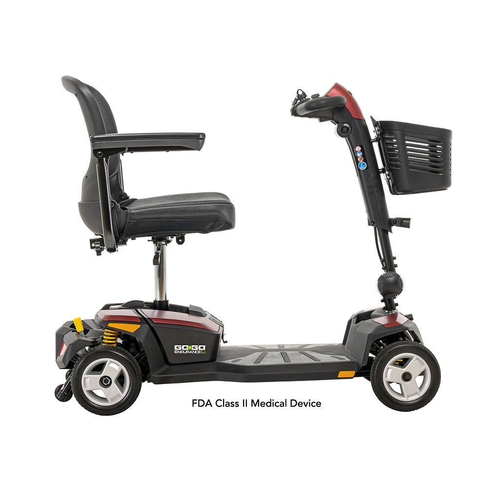 A burgundy and black four-wheeled mobility scooter with a mesh back seat and front storage basket on a white background.