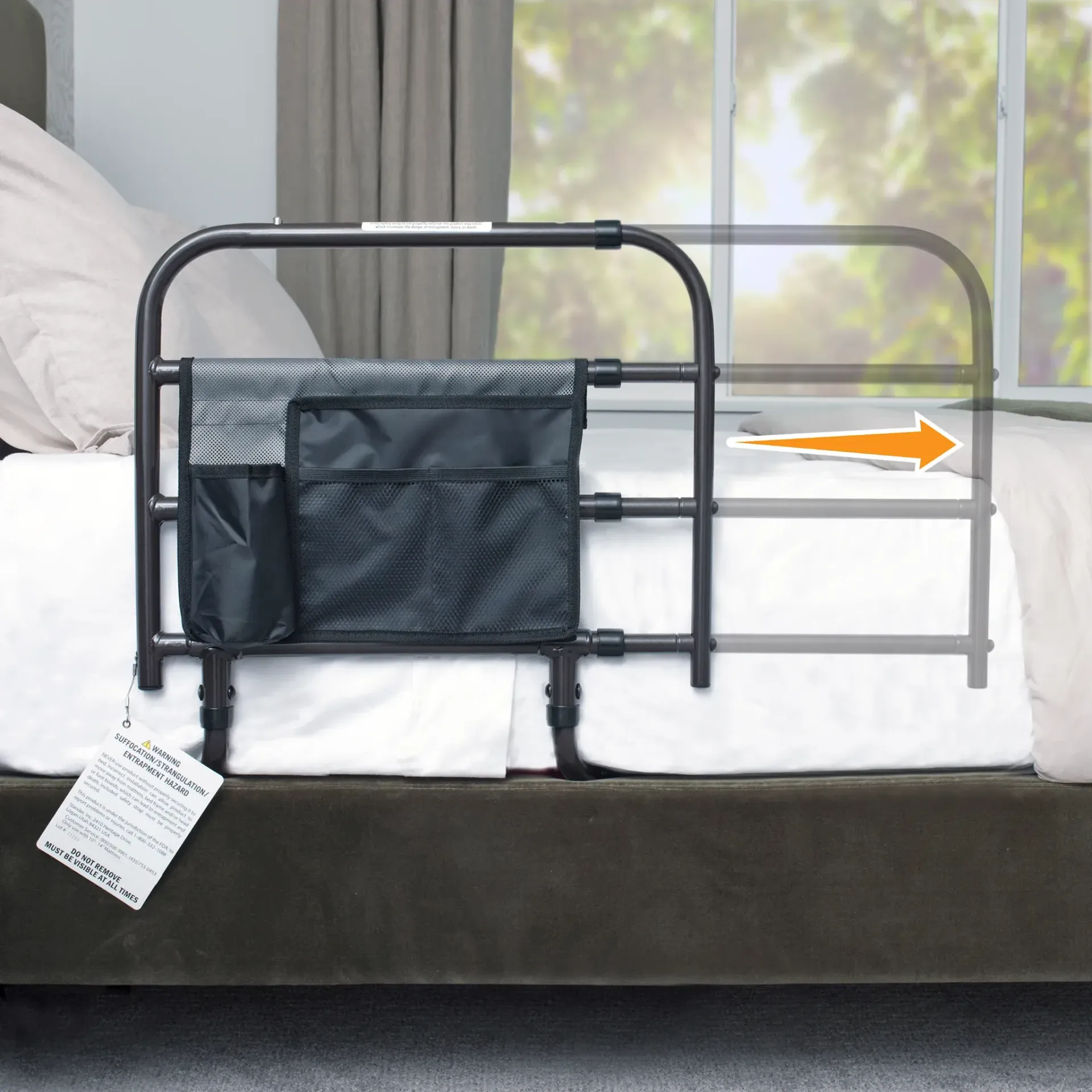 Adjustable bed rail with a storage pouch attached to the side, shown partially extended with an arrow indicating movement.