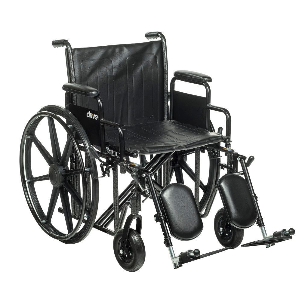 A black, folding, manual wheelchair with large rear wheels and adjustable leg rests against a white background.