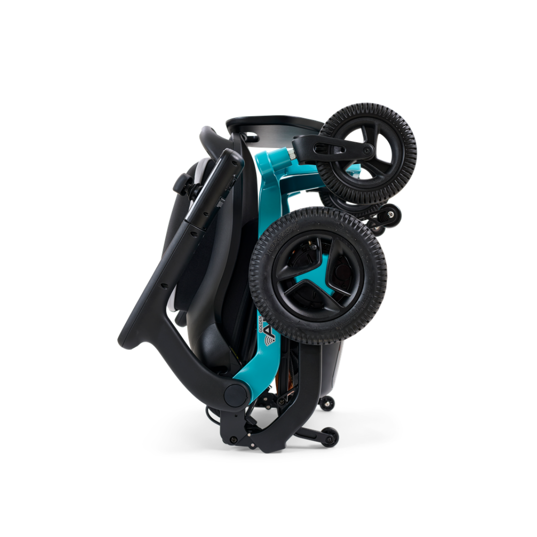 A teal-colored power wheelchair with black seating, armrests, and a storage basket underneath, on a white background.