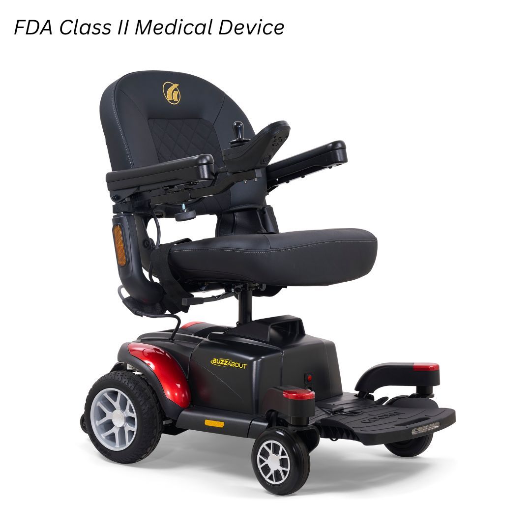 Black power wheelchair with a red frame, padded seat, armrests, and joystick controller against a white background.