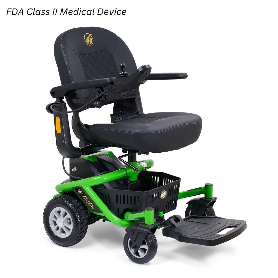 A green and black electric power wheelchair with a seat, joystick controller, and storage basket on a white background.
