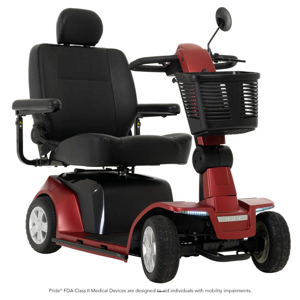 A red four-wheeled mobility scooter with a black leather seat, armrests, and a front storage basket on a white background.