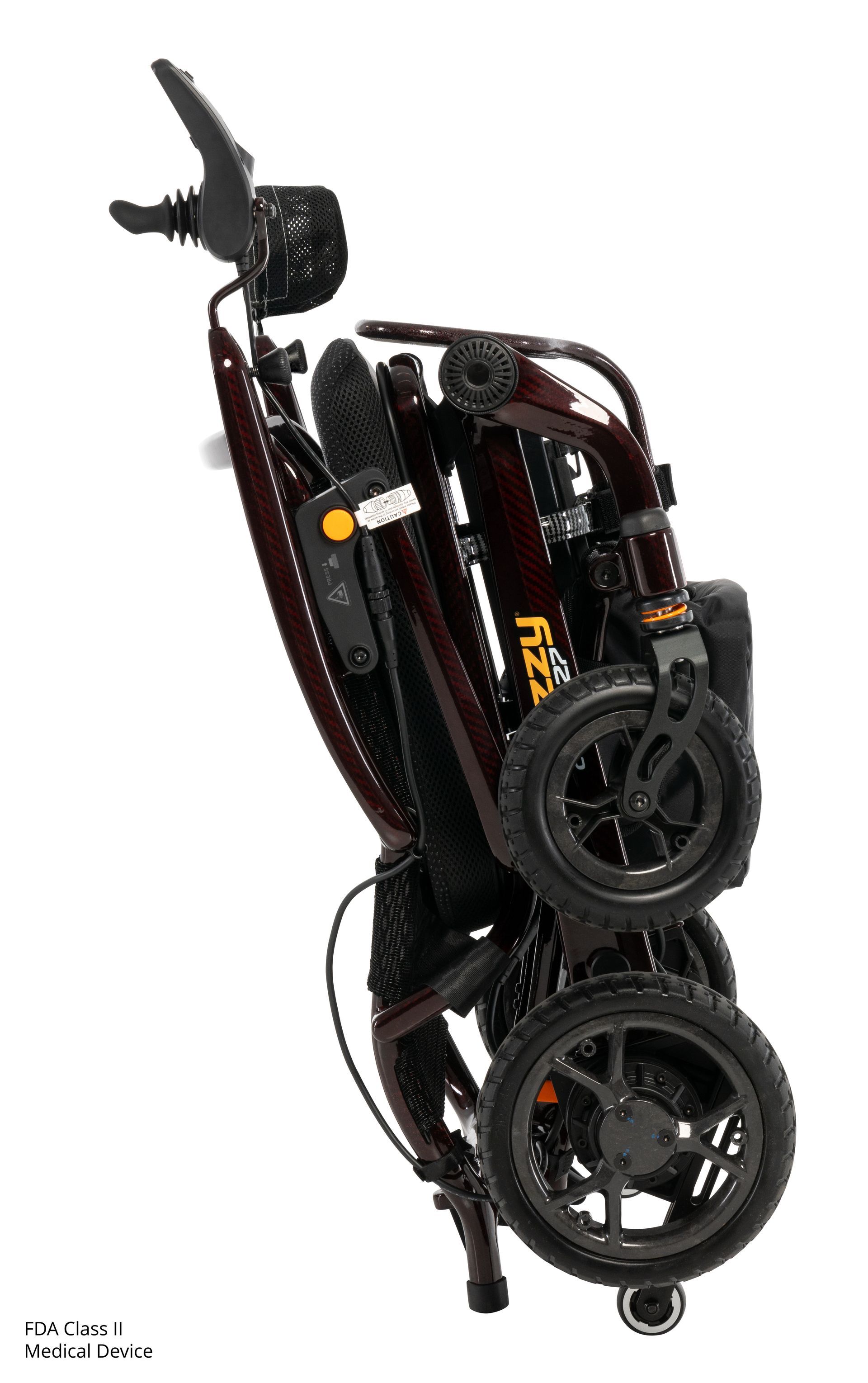 A dark brown Jazzy Carbon folding power wheelchair with a black mesh backrest and a footrest on a white background.