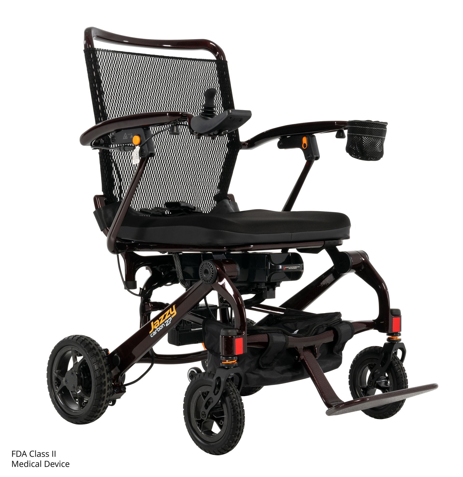 A dark brown Jazzy Carbon folding power wheelchair with a black mesh backrest and a footrest on a white background.