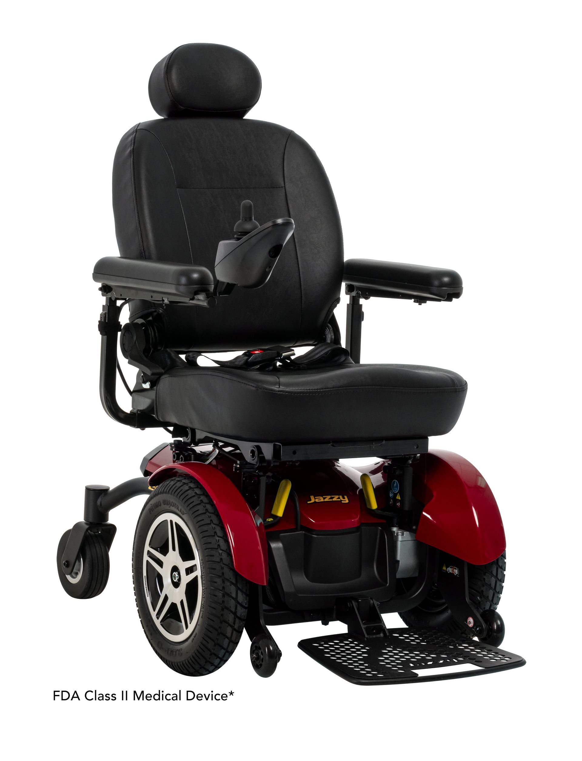 A red power wheelchair with black seating and a headrest, set against a white background.