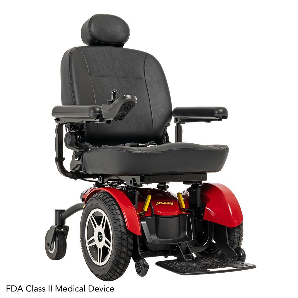 A red and black motorized power wheelchair with a headrest and joystick controller, identified as an FDA Class II device.
