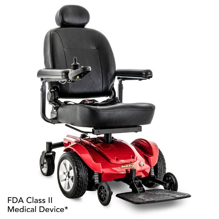 A red and black electric power wheelchair with a headrest, armrests, and a joystick controller.
