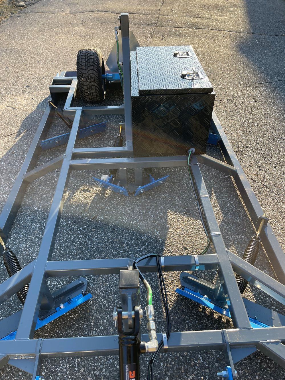 A trailer is parked on the side of the road.