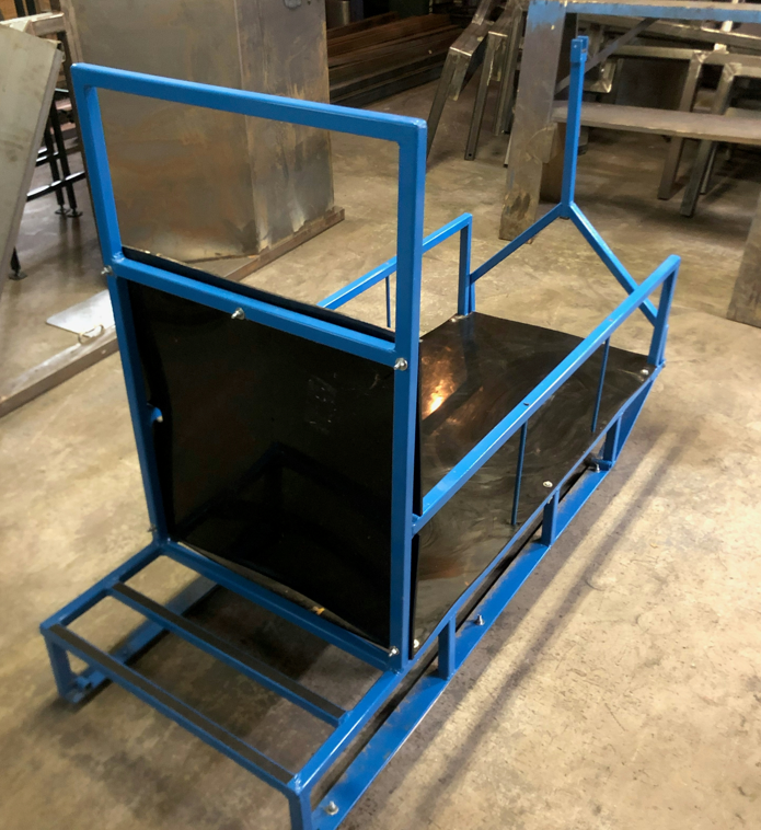 A blue metal frame with a black item on it
