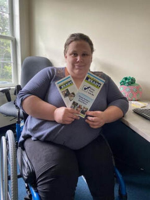Marisa Douglas - Peer Support Specialist - Atlantic Center for Independent Living - Holding Pamphlets